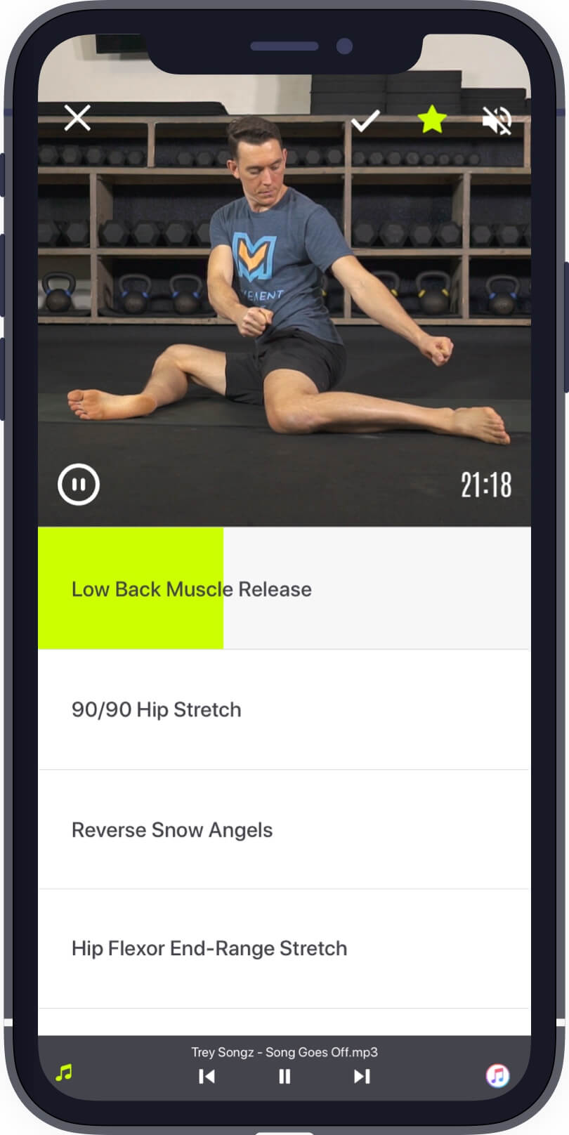 Man performing 90-90 hip stretch in the #1 stretching and mobility app